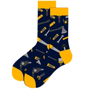 Detail of navy blue crew socks with yellow accents and creative hardware tool patterns