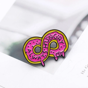 Pink infinity donut enamel pin with Always Hungry text on a minimalist background