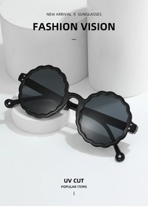 Detail of round sunglasses with black wavy frame and UV CUT functional gray lenses