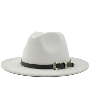 Detail of white wool fedora hat featuring a black faux leather band and bronze buckle