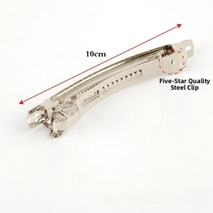 Silver metal hair clip detail with steel grid texture and 10cm measurement scale
