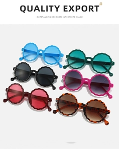 Detail shot of round wavy-edged sunglasses in various vibrant colors and glossy finishes