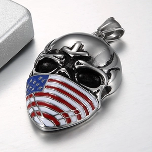 Detailed macro view of punk skull pendant with American flag enamel and brushed metal finish