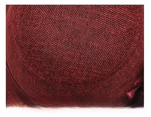 Close-up of top suture technique and woven texture on deep red linen cloche hat