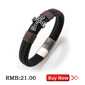 Detail of men's leather bracelet with silver Ankh cross and magnetic clasp
