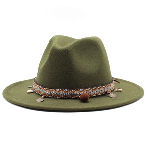 Detail of dark green wool felt hat with ethnic geometric band and vintage bead accents