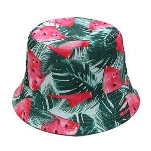 Detailed close-up of vibrant watermelon and monstera leaf print on cotton bucket hat