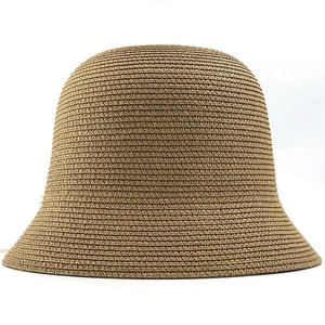 Detailed view of the woven texture and natural fibers on the brown straw sun hat