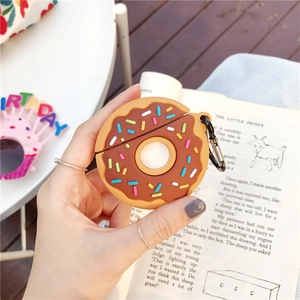 Chocolate donut silicone AirPods case with carabiner shown in a lifestyle setting