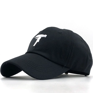 Cotton baseball cap in black with white handgun embroidery and curved brim