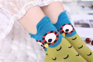 Detailed view of kids cotton socks with cute cartoon owl pattern and 3D ears design