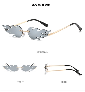 Detail view of flame shaped rimless sunglasses in silver metal frame and grey lenses