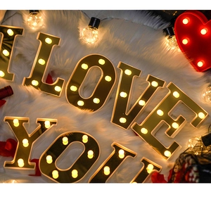 Romantic LED I LOVE YOU gold letter lights and red heart on faux fur with rose petals