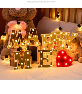 Detail of LED MARRY ME letters and red heart lamp for romantic wedding decoration