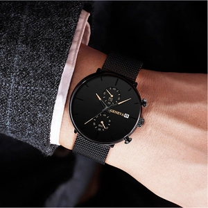 Close-up of Geneva men's black mesh watch with calendar dial and professional business style