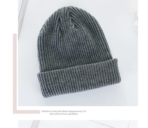 Detailed view of gray knit beanie featuring classic ribbing and thick folded cuff design