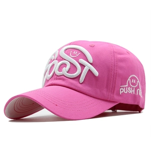 Close-up of pink baseball cap with 3D embroidery and Push Me smiley face detail