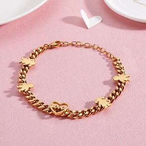 Golden bracelet featuring family figure pendants and a love heart on pink background