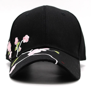 Black cotton baseball cap with pink cherry blossom embroidery and curved brim for women