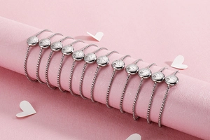 Detailed view of twelve zodiac silver titanium steel adjustable bracelets with diamonds