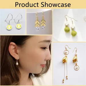 Various handmade S925 silver earrings including lemon patterns and pearl drops