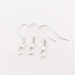 Macro shot of S925 sterling silver ear hooks with coil and loop for DIY jewelry making