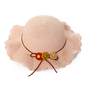 Pink straw sun hat for girls with woven wavy brim and colorful daisy flower decor