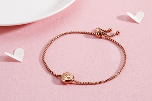 Macro detail of rose gold constellation bracelet with sparkling diamond inlay