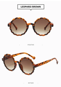 Detailed front and 45-degree side views of leopard print sunglasses with wavy frames