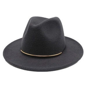 Detailed close-up of dark grey fedora hat with elegant gold metal buckle band