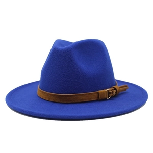 Close-up of royal blue wool fedora hat featuring a brown leather strap and metal buckle
