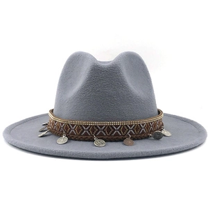 Detail of light gray wool fedora hat with ethnic woven band and vintage coin pendants