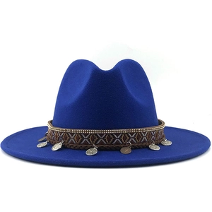Close-up of royal blue wool fedora with ethnic woven band and metallic coin pendants