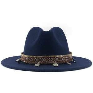 Detail of dark blue fedora with woven band, gold beads and vintage metal coins