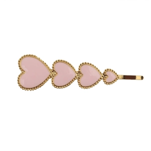 Golden alloy hair clip featuring four graduated pink enamel hearts with beaded edge details