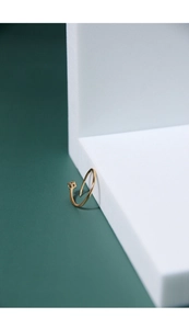Close-up of golden S925 sterling silver ring with a square-cut sparkling zircon stone