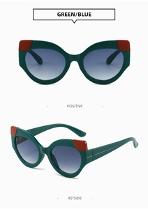 Detailansicht der grünen Cateye-Sonnenbrille mit roten Akzenten und blauem Verlauf