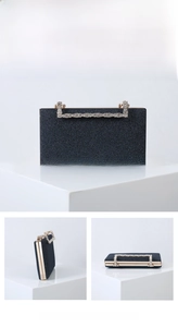 Detailed views of a navy glitter clutch bag with sparkling rhinestone handle and metal frame