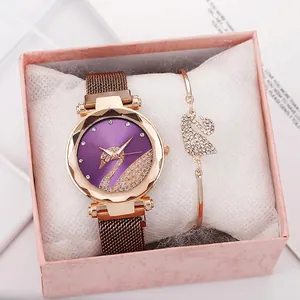 Elegant rose gold watch and swan bracelet set with purple dial and crystal accents