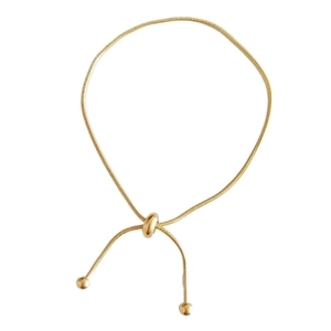 Minimalist gold snake chain bracelet with an adjustable sliding bead clasp closure