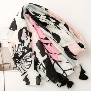 Tropical floral print cotton linen feel scarf with black tassels on white background