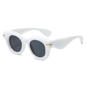 Retro round white frame sunglasses with dark grey lenses and gold metal accents