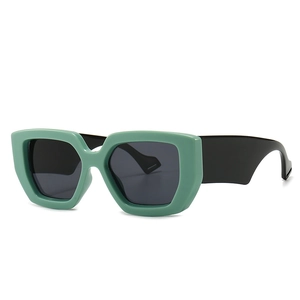 Modern retro oversized sunglasses with mint green geometric frames and black temples