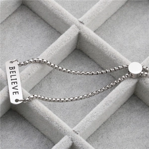Polished stainless steel box chain bracelet with engraved BELIEVE bar and adjustable slide