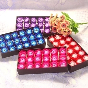 Detail view of four 18-piece rose soap flower gift boxes in red, pink, blue and purple