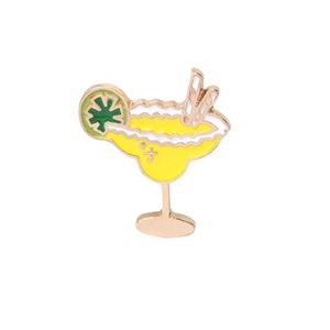 Detailed view of Margarita cocktail enamel pin with yellow filling and lemon slice decor