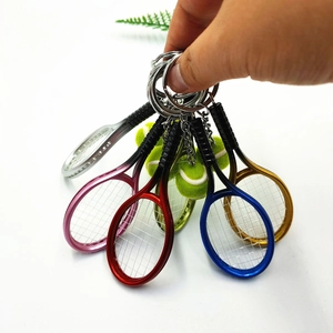Mini tennis racket and ball keychain set in assorted metallic colors for sports gifts