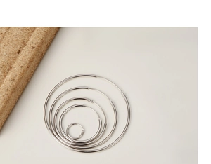 Minimalist s925 silver hoop earrings shown in five different sizes on neutral background