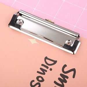 Metal silver clipboard clip with rubber corners on pink grid background for A4 file boards