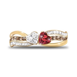 Golden ring with double heart-shaped stones and wave band encrusted with fine crystals